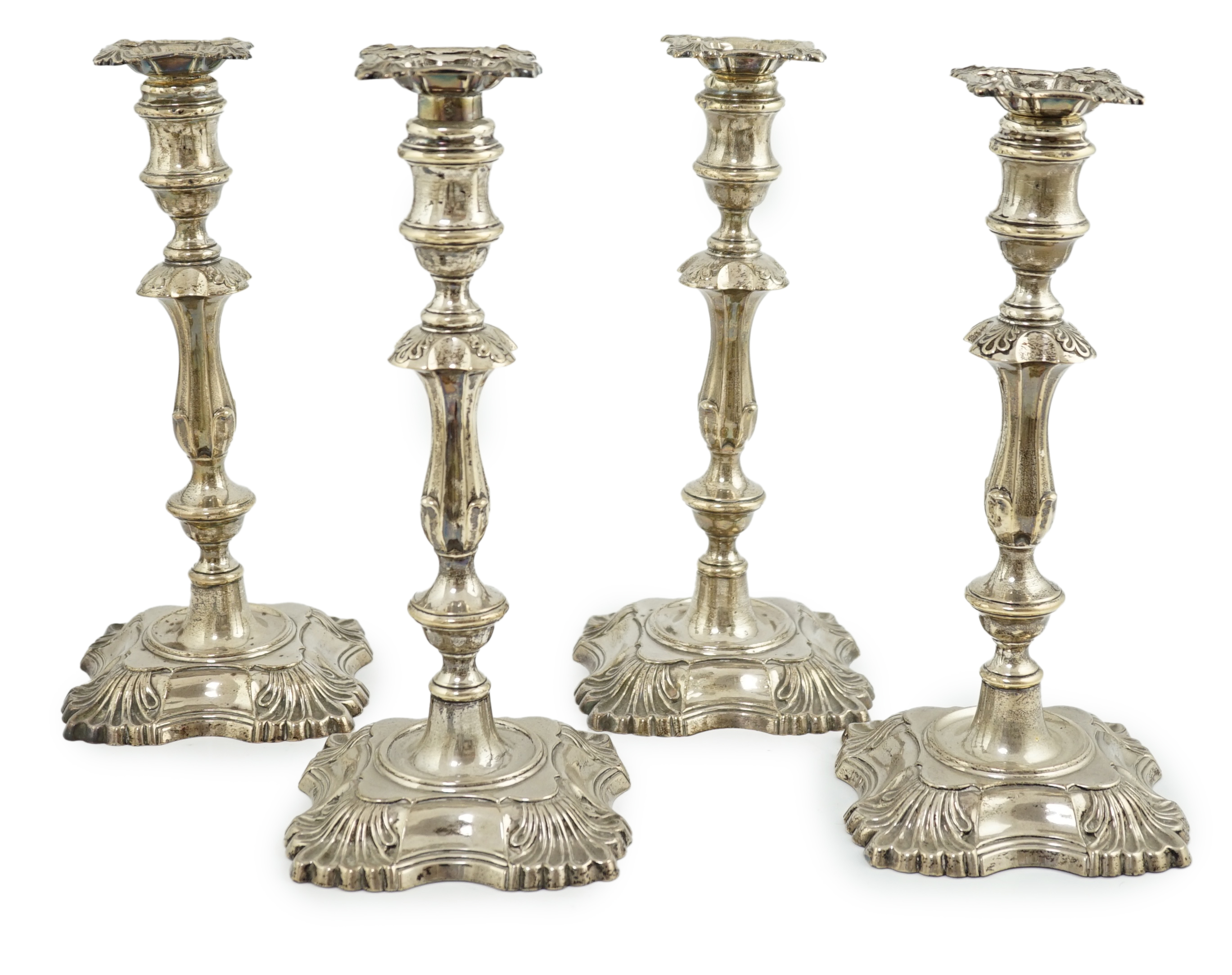 A matched set of four late Victorian/Edwardian silver candlesticks, by William Hutton & Sons Ltd